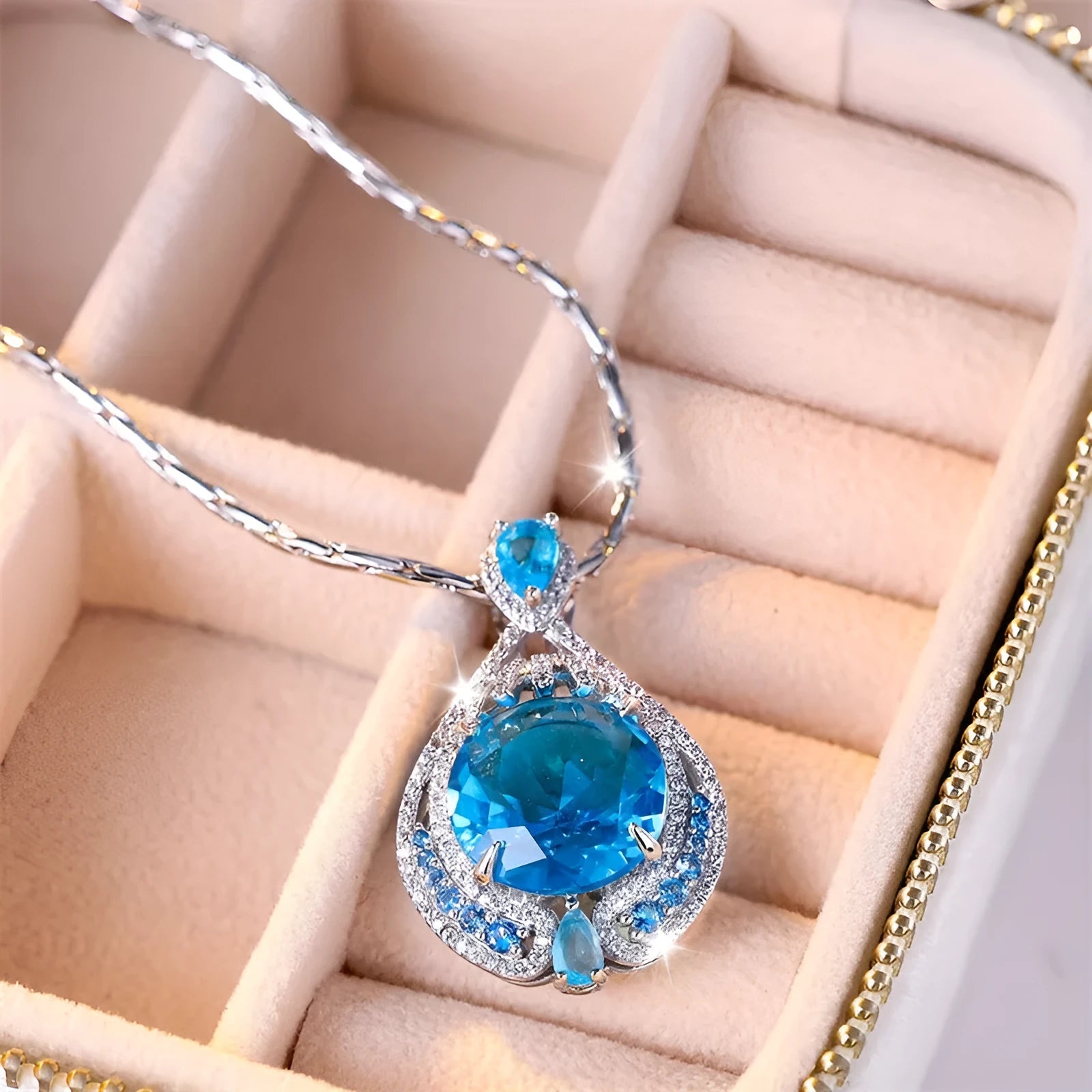 Blue geometric crystal pendant necklace with fireworks cut design on water wave chain