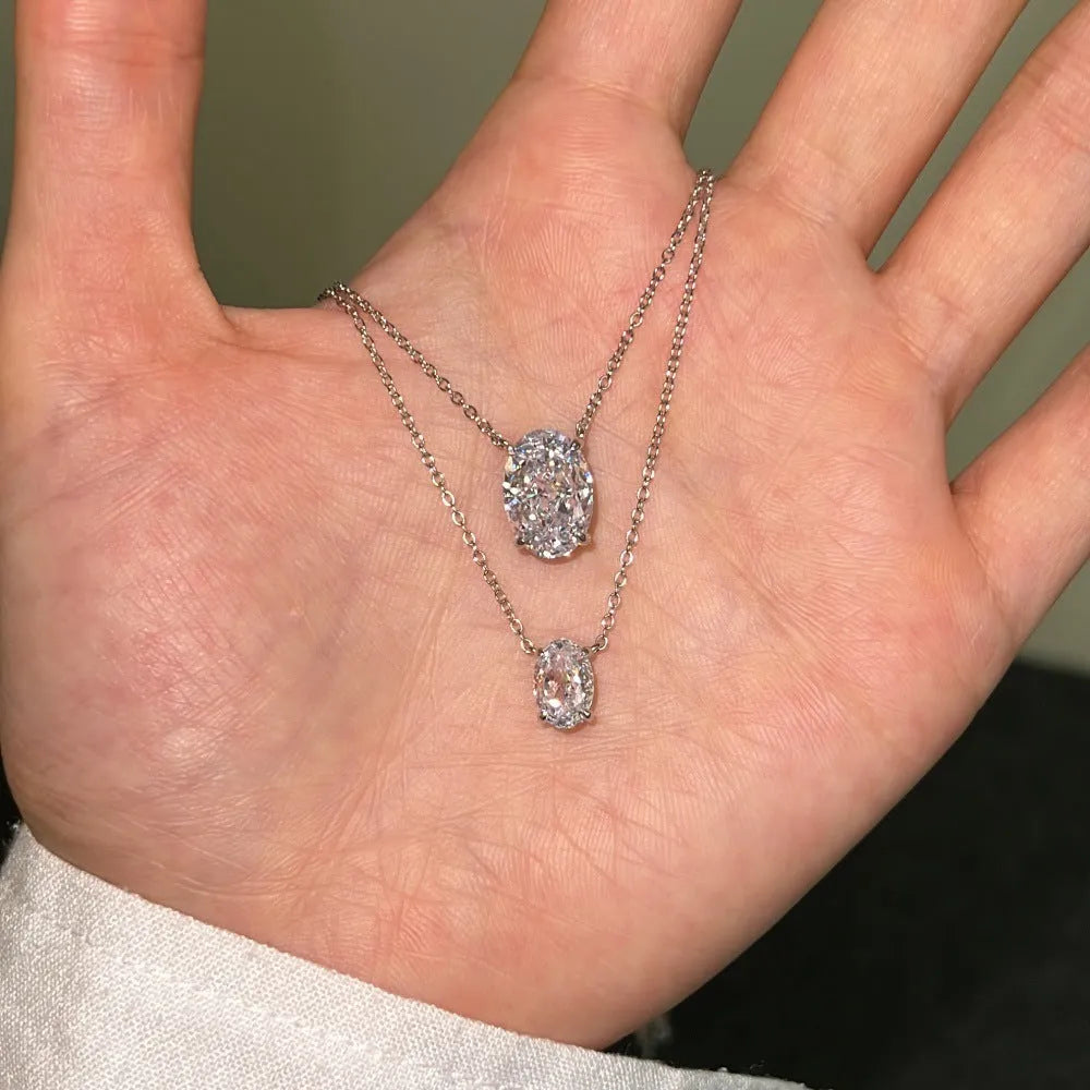 S925 sterling silver necklace with geometric oval ice flower pendant in gold or platinum finish.