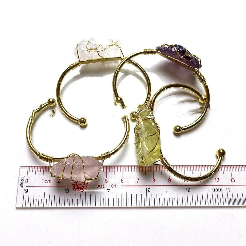 Natural rough crystal stone bracelet with geometric gold tone metal winding, bohemian style.