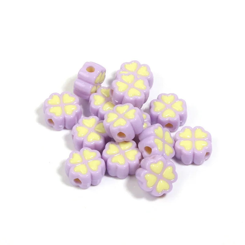 Acrylic four-leaf clover beads with frosted finish in mixed cartoon colours
