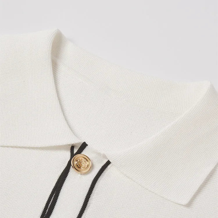 White short sleeve cardigan with contrasting colour lapels laid flat.