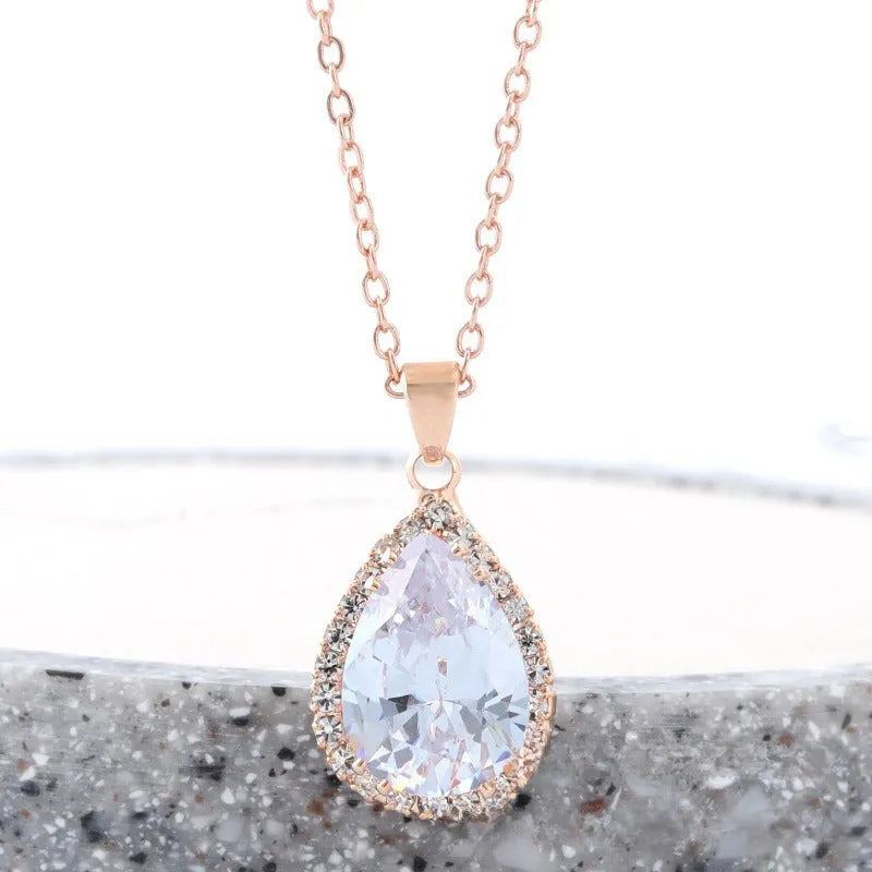 Drop shape geometric pendant necklace with rhinestone inlay in pink rose gold electroplated finish