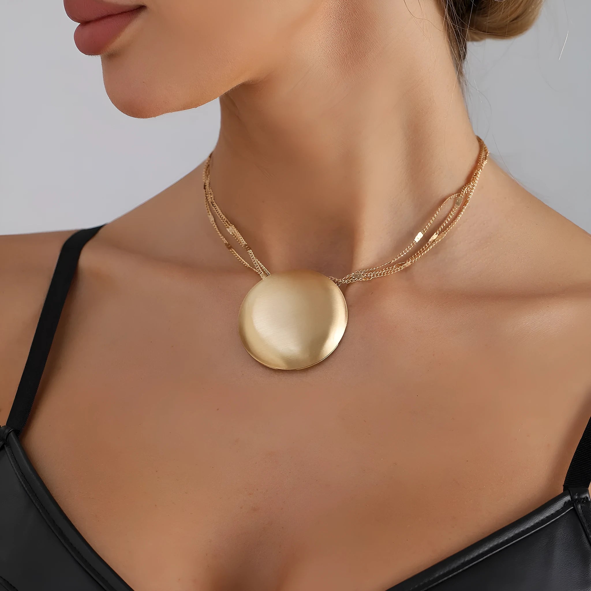 Gold electroplated alloy vintage geometric round pendant necklace with love heart motif on clavicle chain
