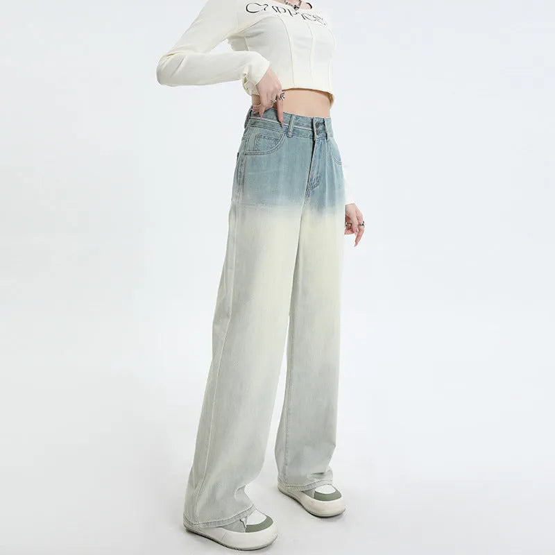 Women's gradient blue straight-leg denim trousers on a model, showing the ombré colour effect.