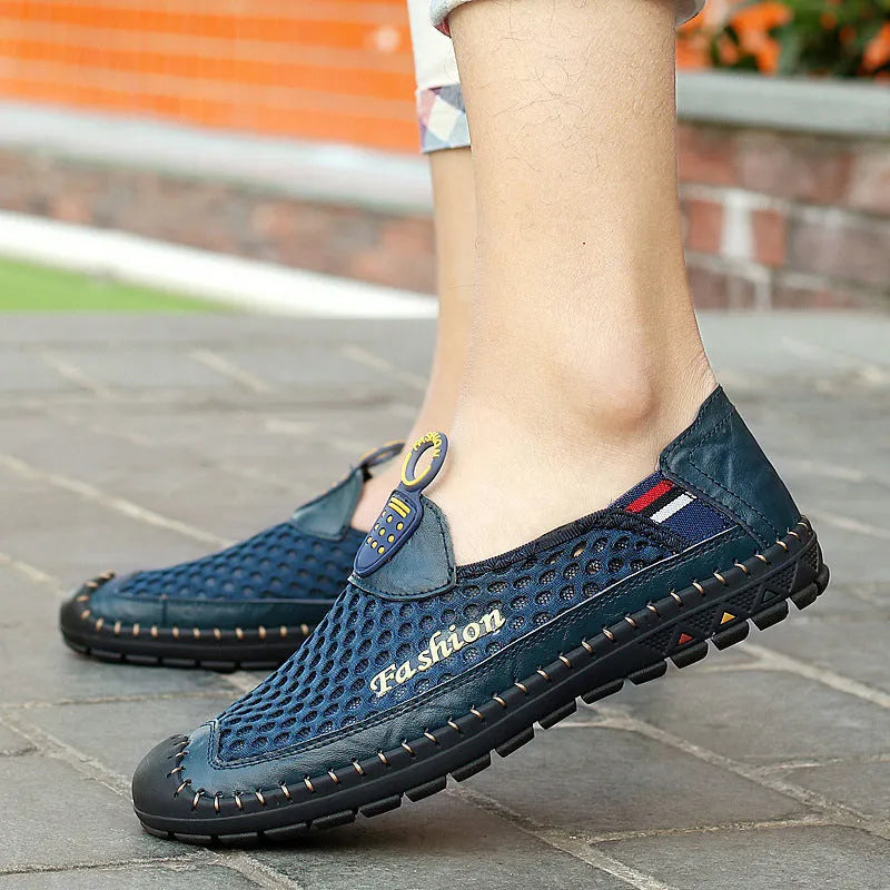 Men's brown casual shoes with mesh upper and rubber sole, showing round toe and stitching detail