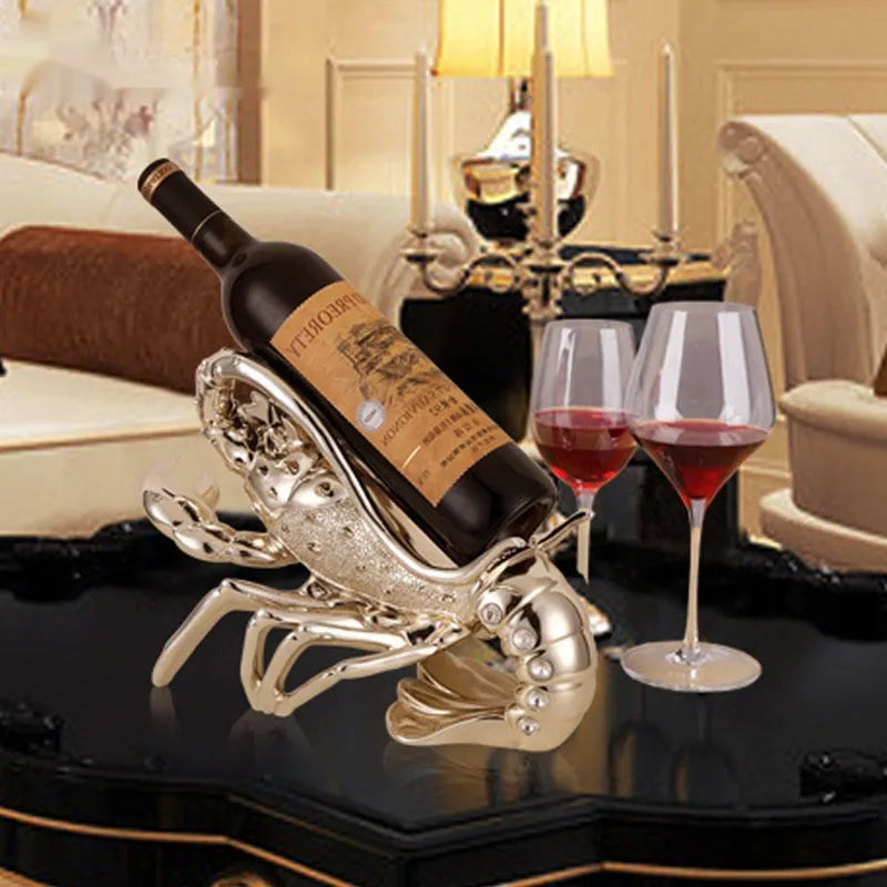 Lobster-shaped decorative wine rack ornament in metallic rose gold holding a wine bottle.