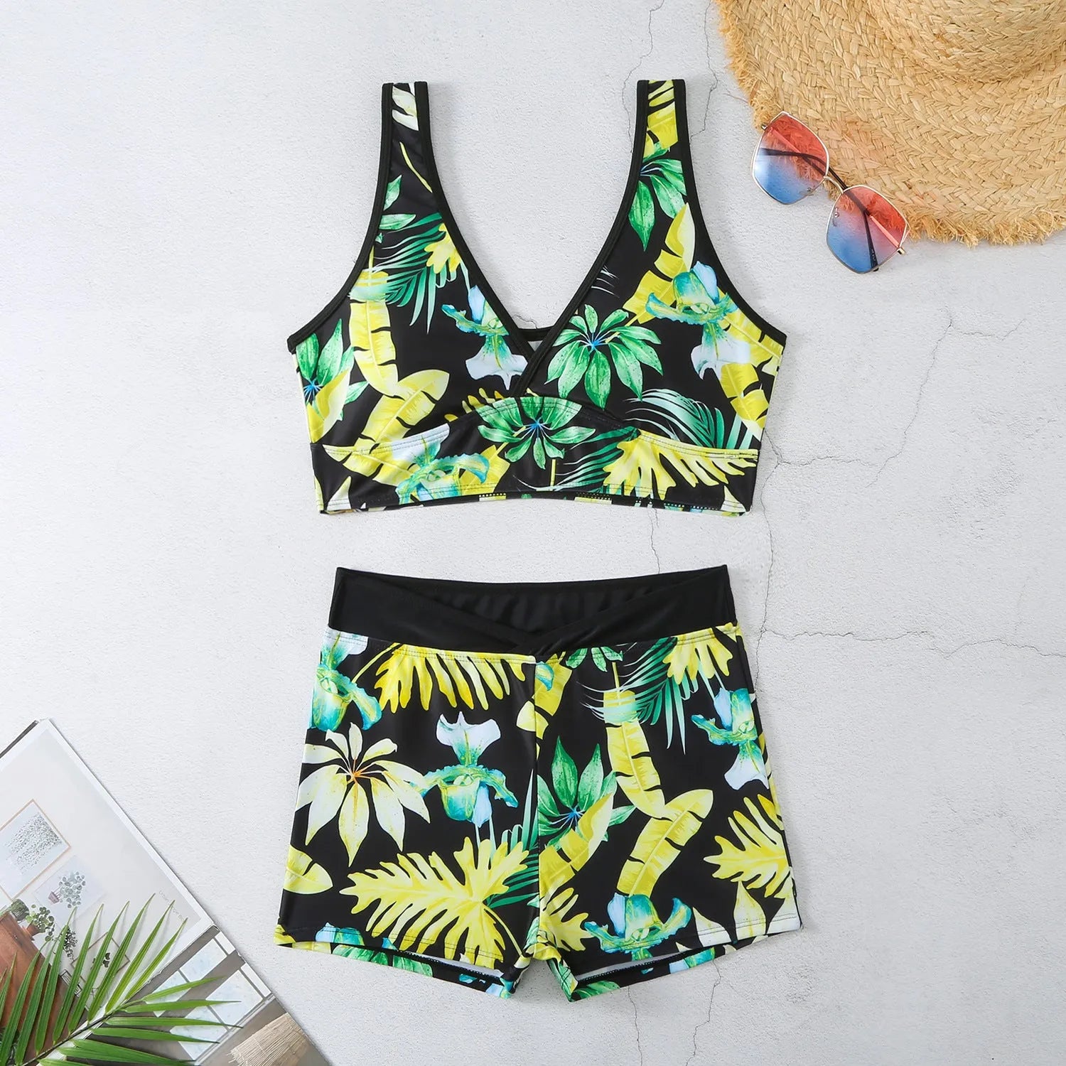Women's two-piece sleeveless swimsuit with boxer shorts in a multi-colour print.