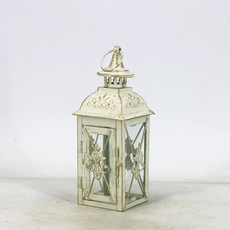 Black and white wrought iron floor-standing storm lantern with tempered glass panels for courtyard use