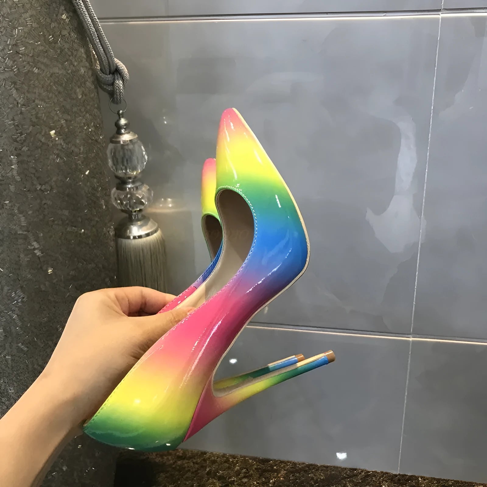 Rainbow coloured women's patent leather sandals with a pointed toe and an ultra-high thin heel.