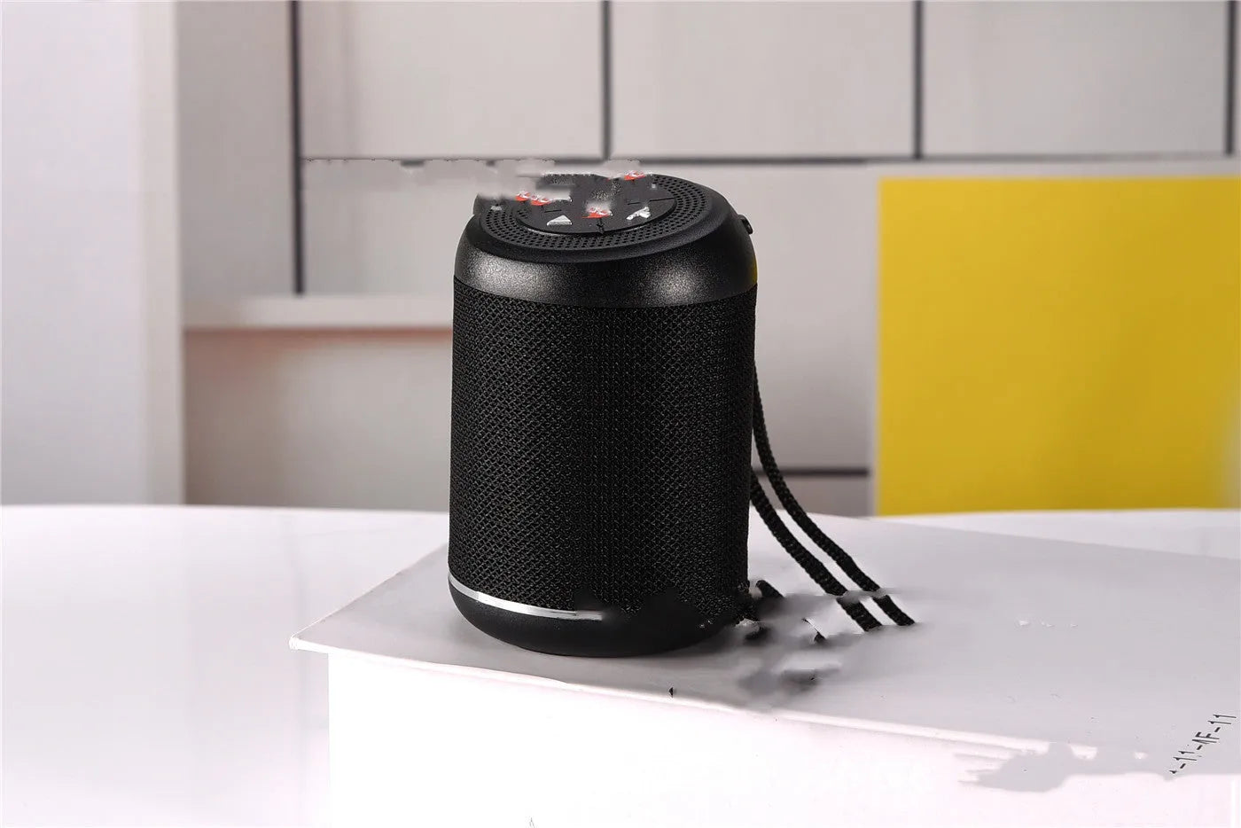 Portable outdoor Bluetooth subwoofer speaker in multiple colour options including black, blue, and camouflage.