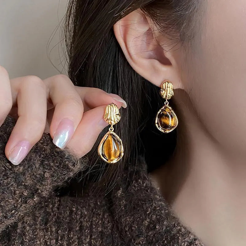 Three pairs of handmade geometric women's earrings with electroplated finishes and tassel details
