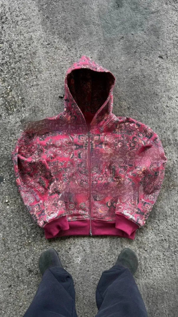 Man wearing a blue loose-fit hooded zip coat with digital print, long sleeves, for casual autumn wear.