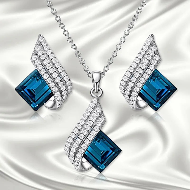 Alloy and glass necklace and earring set with cross chain design and electroplated finish
