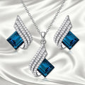Alloy and glass necklace and earring set with cross chain design and electroplated finish