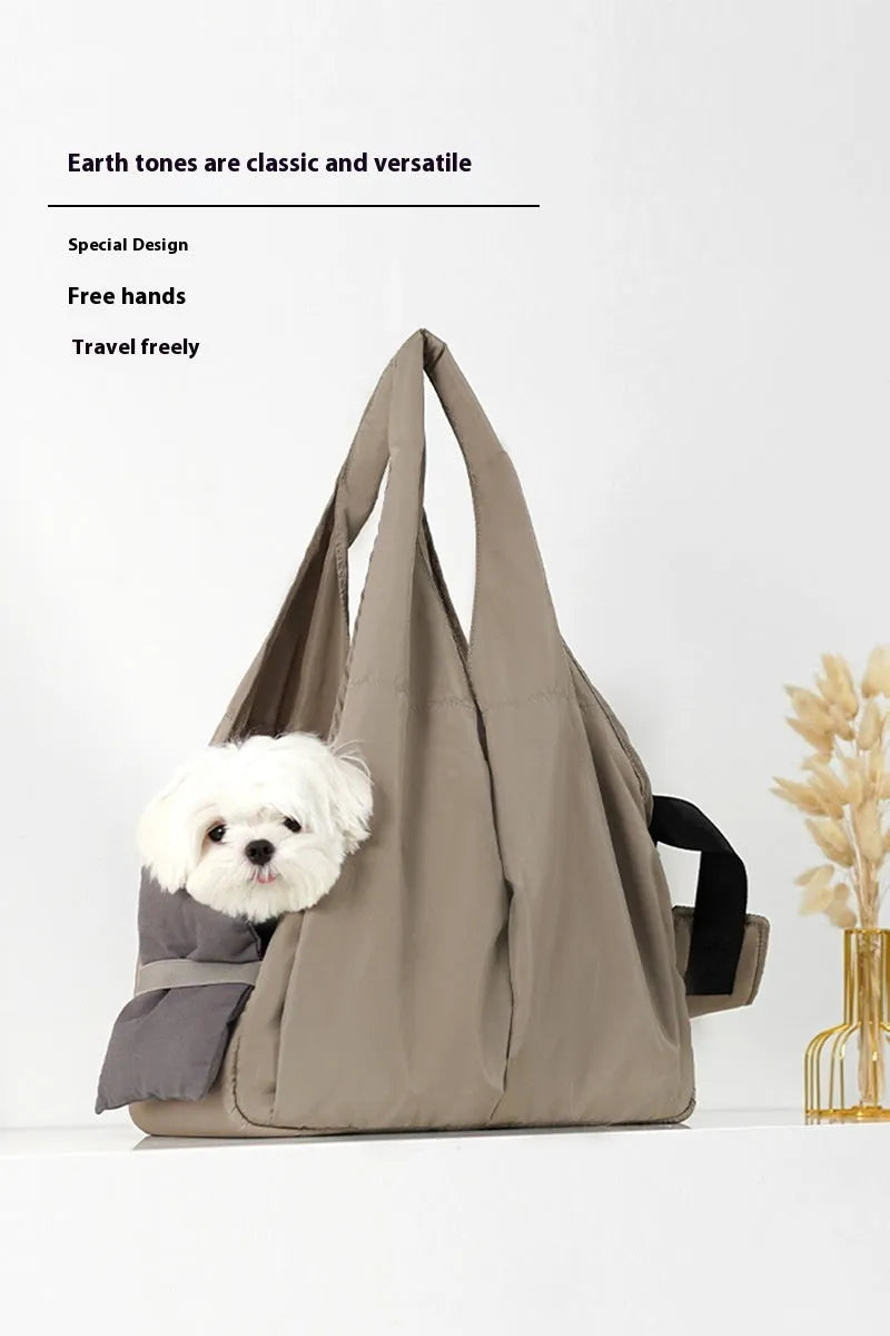 Apricot coloured cloth pet handbag for outdoor summer use.