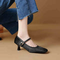 Women's black square toe stiletto ankle-strap high heel shoe made from horse hair.