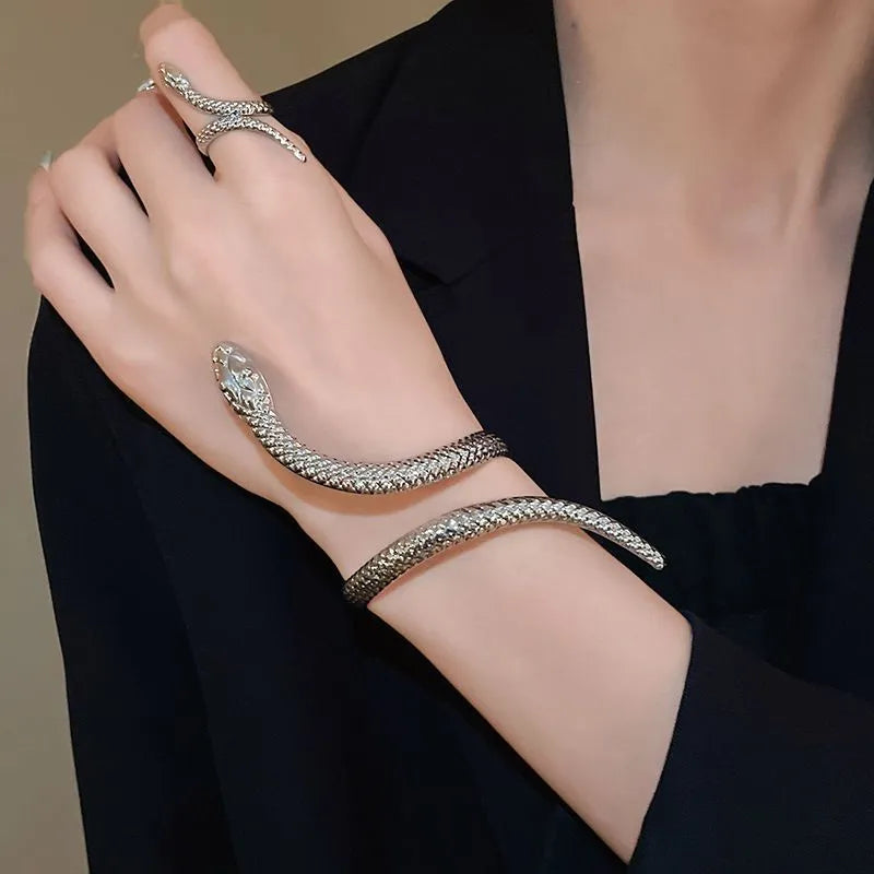 Gold twisted snake design ring and bracelet jewellery set with exaggerated winding metal construction