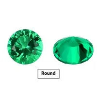 Loose cultivated emerald gemstone in Columbia green colour showing round and fancy cut shapes on a white background.