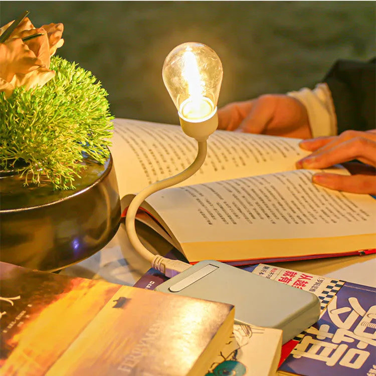 USB rechargeable folding night light with tungsten S14 bulb showing warm white illumination