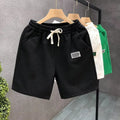 Casual solid colour sports shorts made from elastic polyester fabric.
