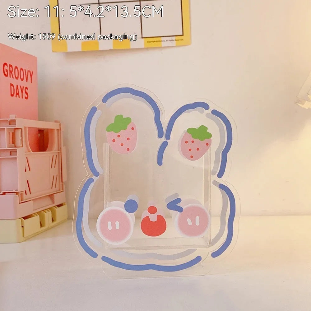 Clear square acrylic storage box with a cute decorative pattern, for stationery on a desk.