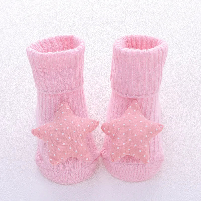 Cotton baby floor socks in various patterns including animal prints, stars, and bows for infants aged 0-3 months