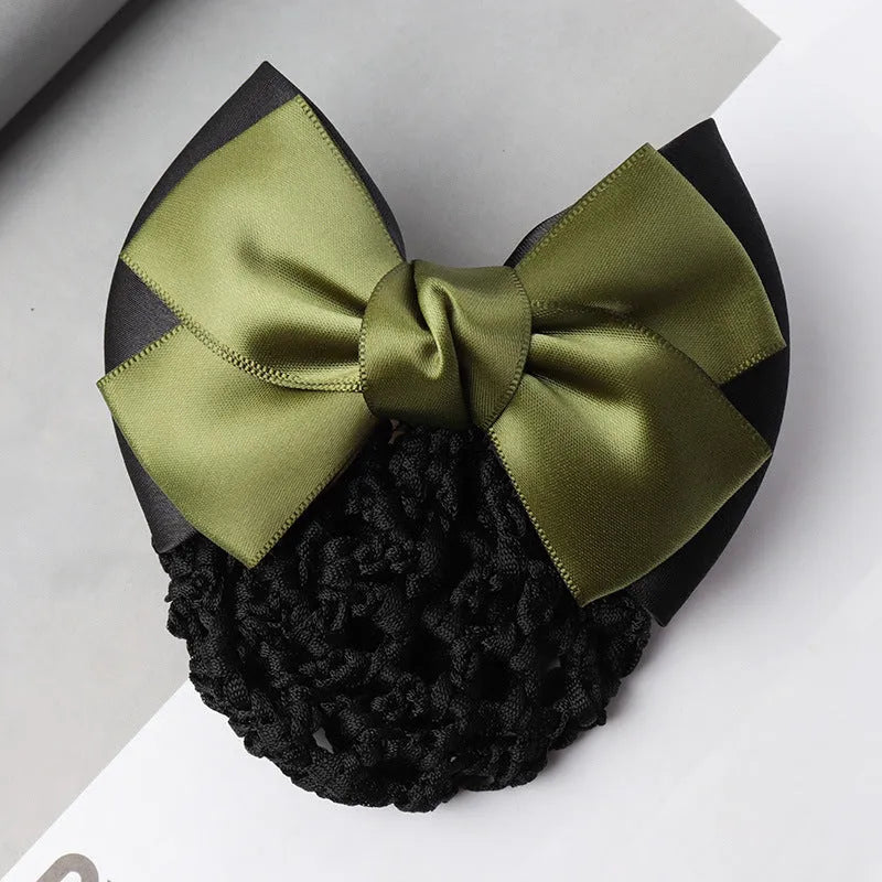 Professional flower bow headdress hair clip ornament on a work plate, shown in a selection of net and mesh colour variations.