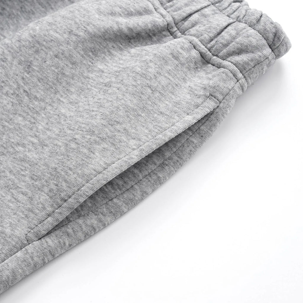 Men's straight-leg cotton casual trousers in black or grey colours with wide cut and mid waist
