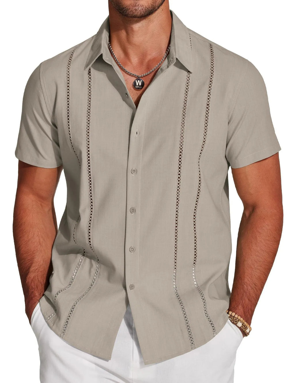 Man wearing a slim fit, short sleeve Hawaiian shirt with a digital print pattern in a casual setting.