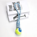 Braided red and white cotton rope dog tug toy for large breeds on a wooden floor.