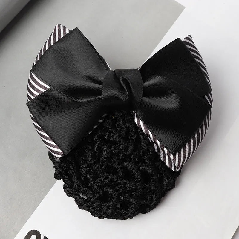 Professional flower bow headdress hair clip ornament on a work plate, shown in a selection of net and mesh colour variations.