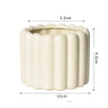 Matte yellow ceramic flower pot with Roman column colour finish for home plant decoration.