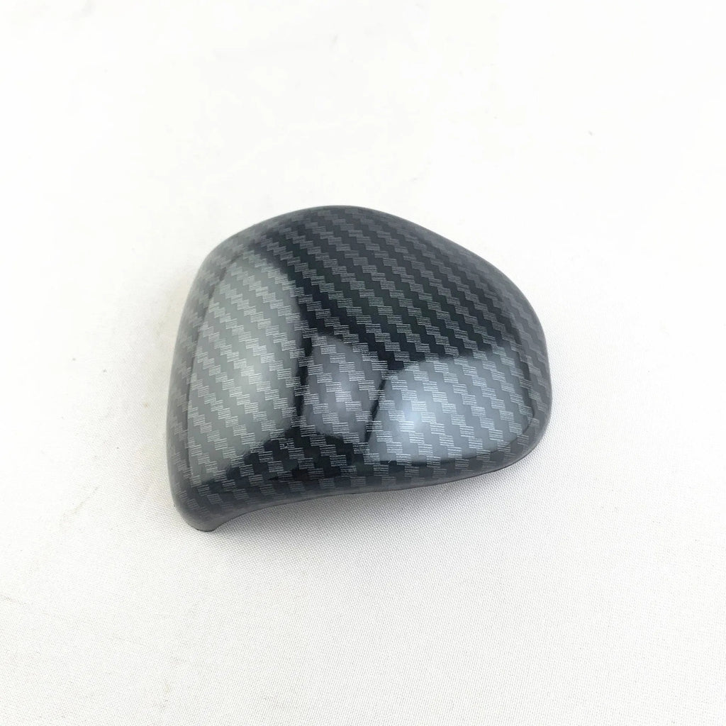 Carbon fibre pattern gear shift knob cover for smart Runk3 car interior.