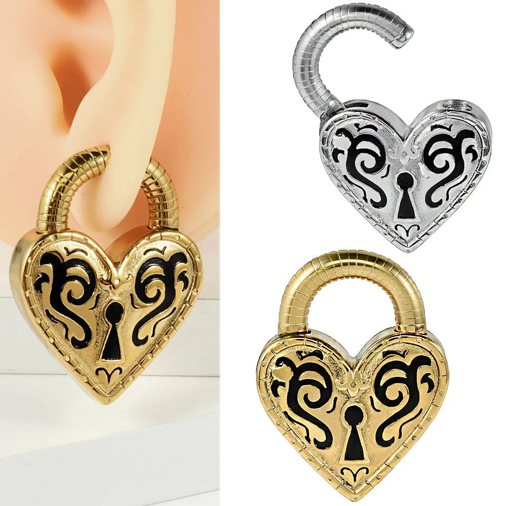 A pair of women's heart-shaped stainless steel earrings in a gold colour finish.