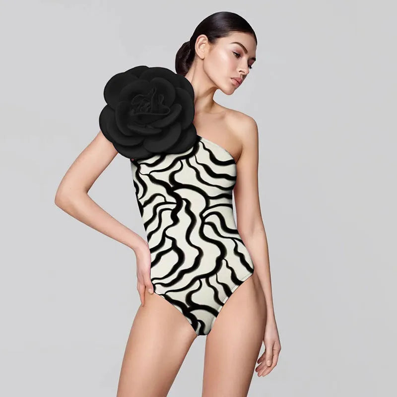 One-piece swimsuit with raised three-dimensional floral pattern in a solid colour, showing a tight European/American style fit.
