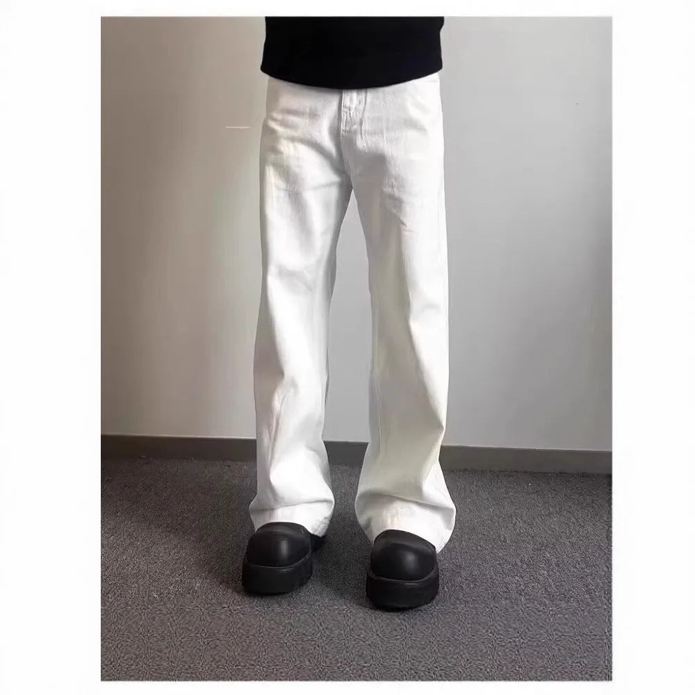 Men's white straight leg jeans with mid-waist zipper fly and loose wide leg cotton denim design