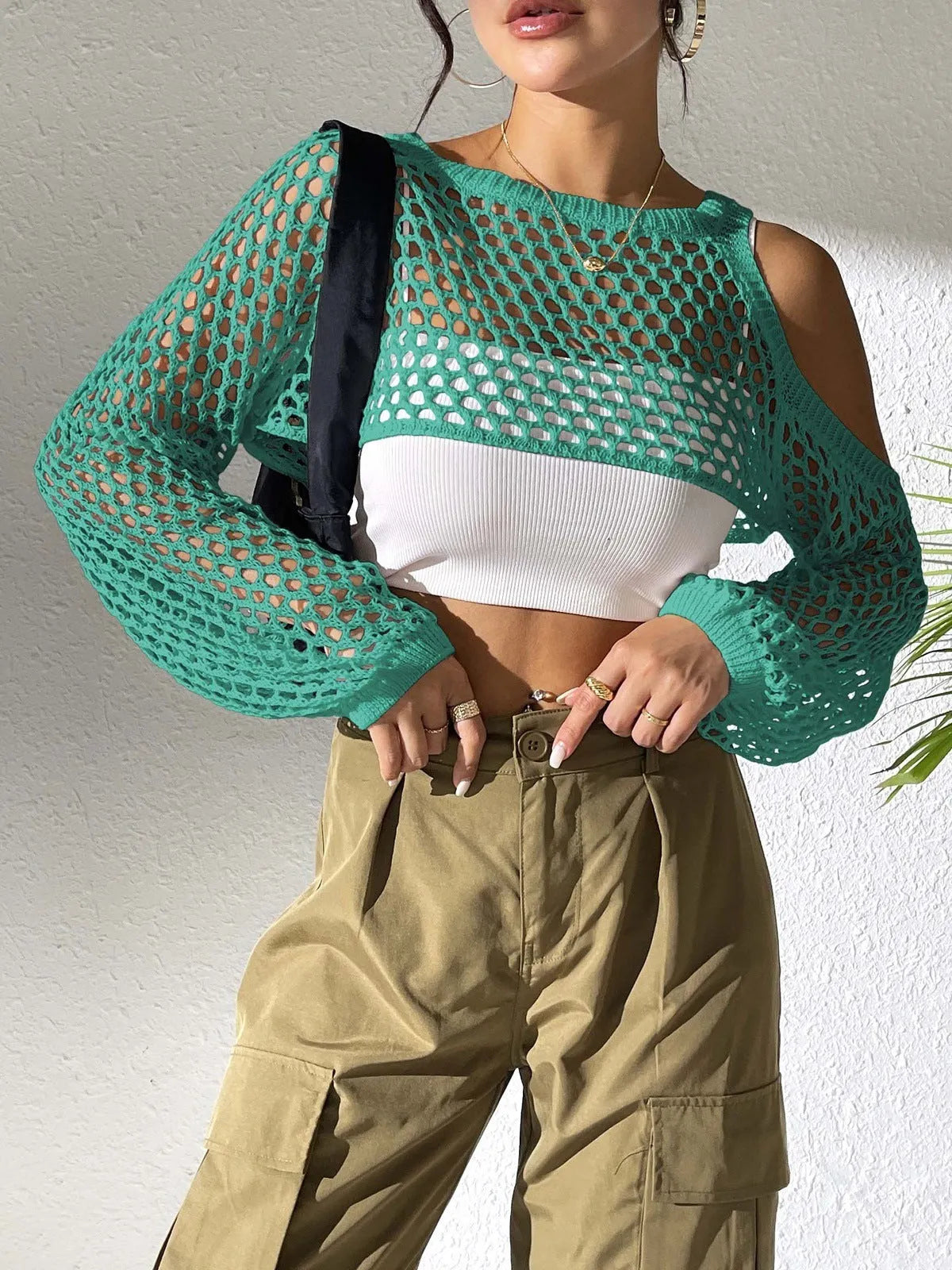 Mesh beach shirt with a hollowed navel section shown in multiple colour options.
