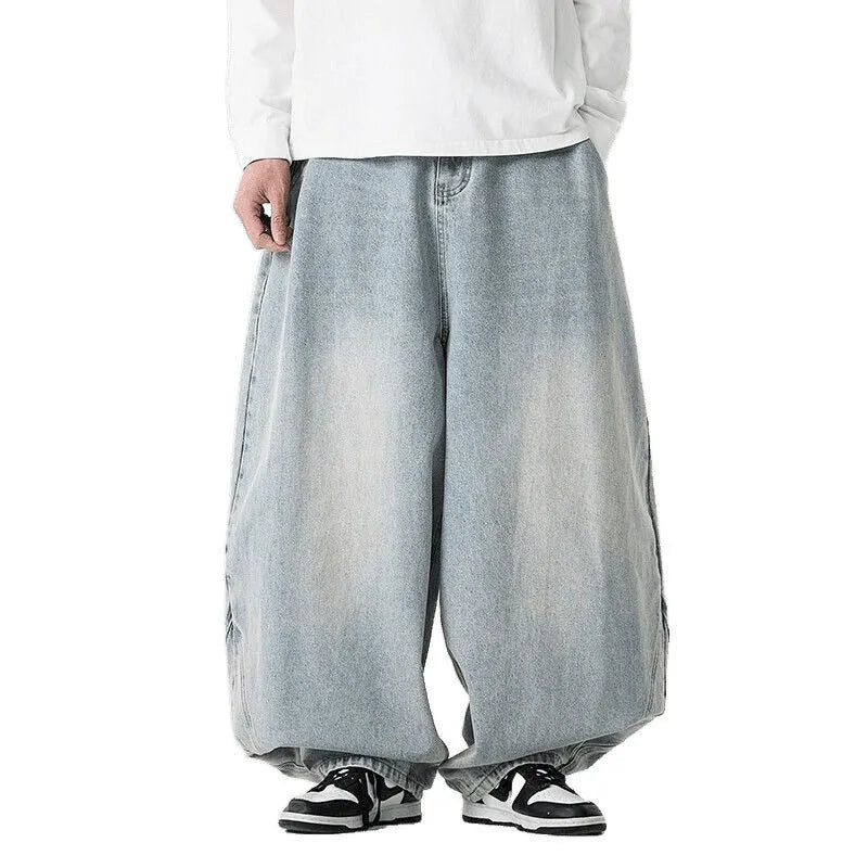 Men's plus-size baggy jeans in light blue denim with straight legs and low waist.