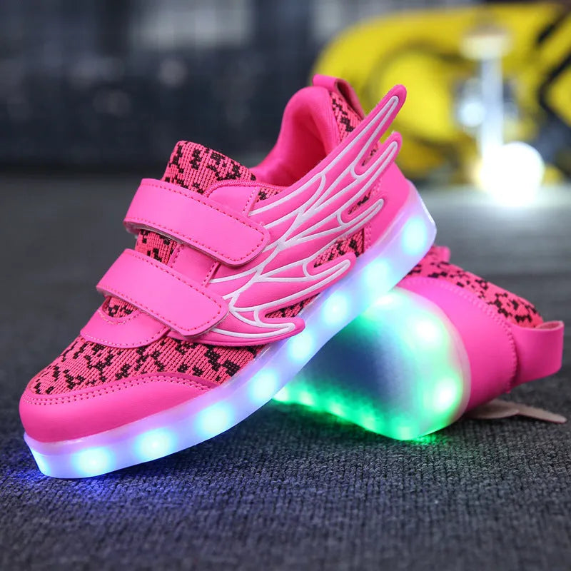 Children's plum red and white LED light up sneakers showing USB charging port and hidden mode switch.