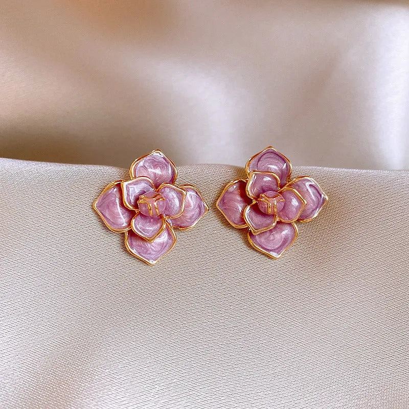 Gold plated purple oil-spot glaze flower stud earrings with copper construction and detailed floral design