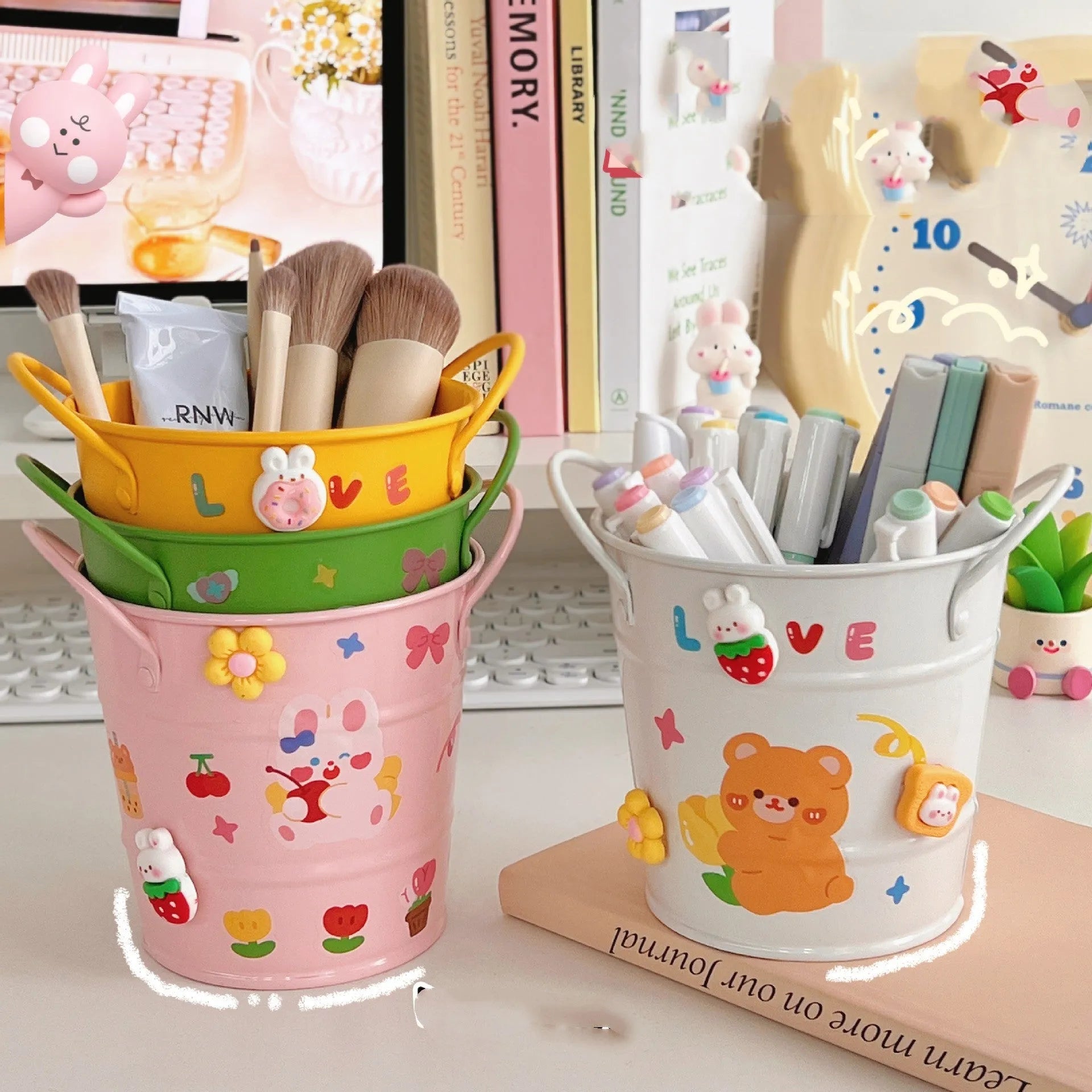 Round metal Creative Iron Art pen holder shown in pink, green, red, white, and yellow colour options on a desk.