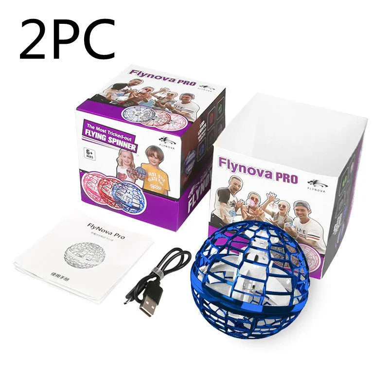 Blue spinning flying ball toy with LED lights hovering above a child's hand next to a magic wand.