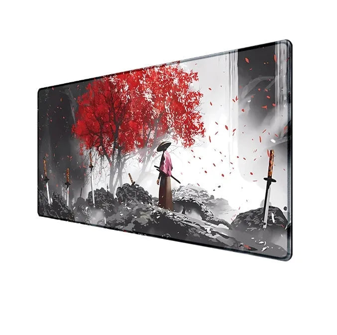 Japanese Samurai design cloth gaming mouse pad with non-slip base on a desk.