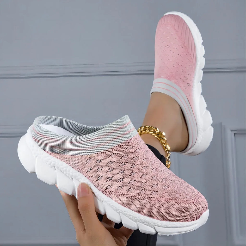 Women's black Flyknit slipper shoes with striped pattern and hollowed-out design on a lightweight viscose sole.