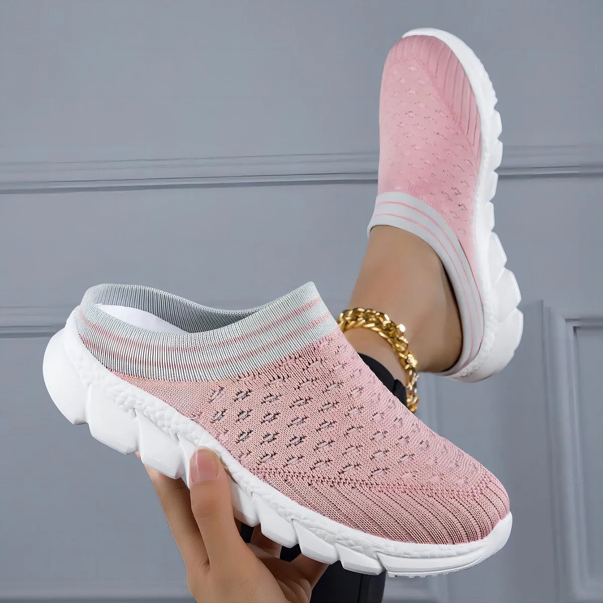 Women's black Flyknit slipper shoes with striped pattern and hollowed-out design on a lightweight viscose sole.
