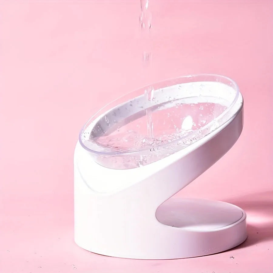 White elevated plastic cat food bowl with a slanted design for comfortable feeding.