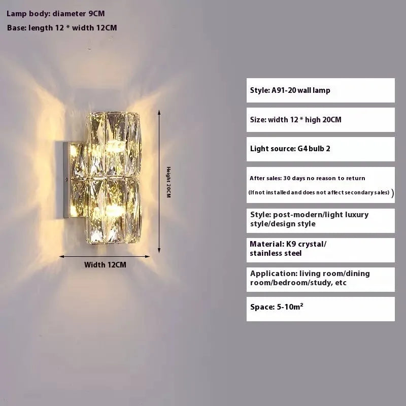 Slim crystal and stainless steel wall lamp with LED light on a wall.