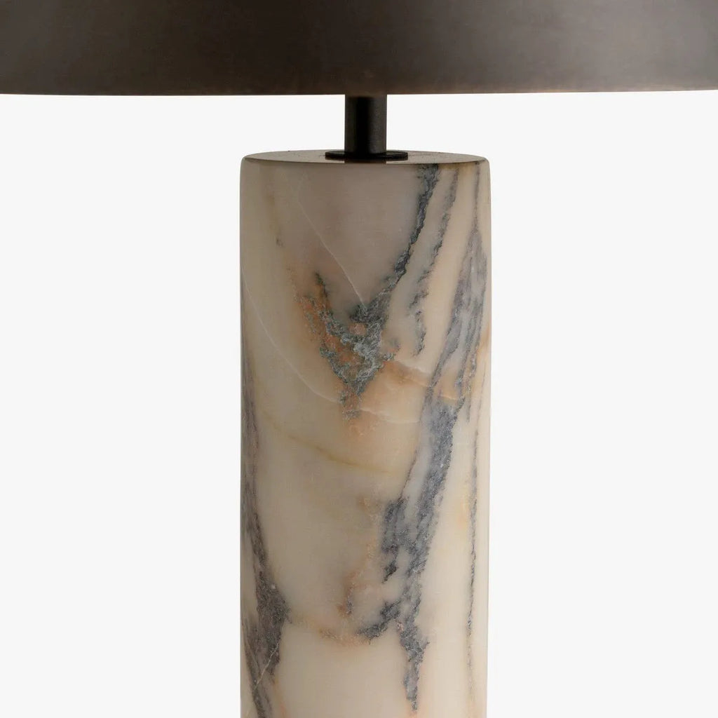Black modern table lamp with a marble base on a wooden desk.
