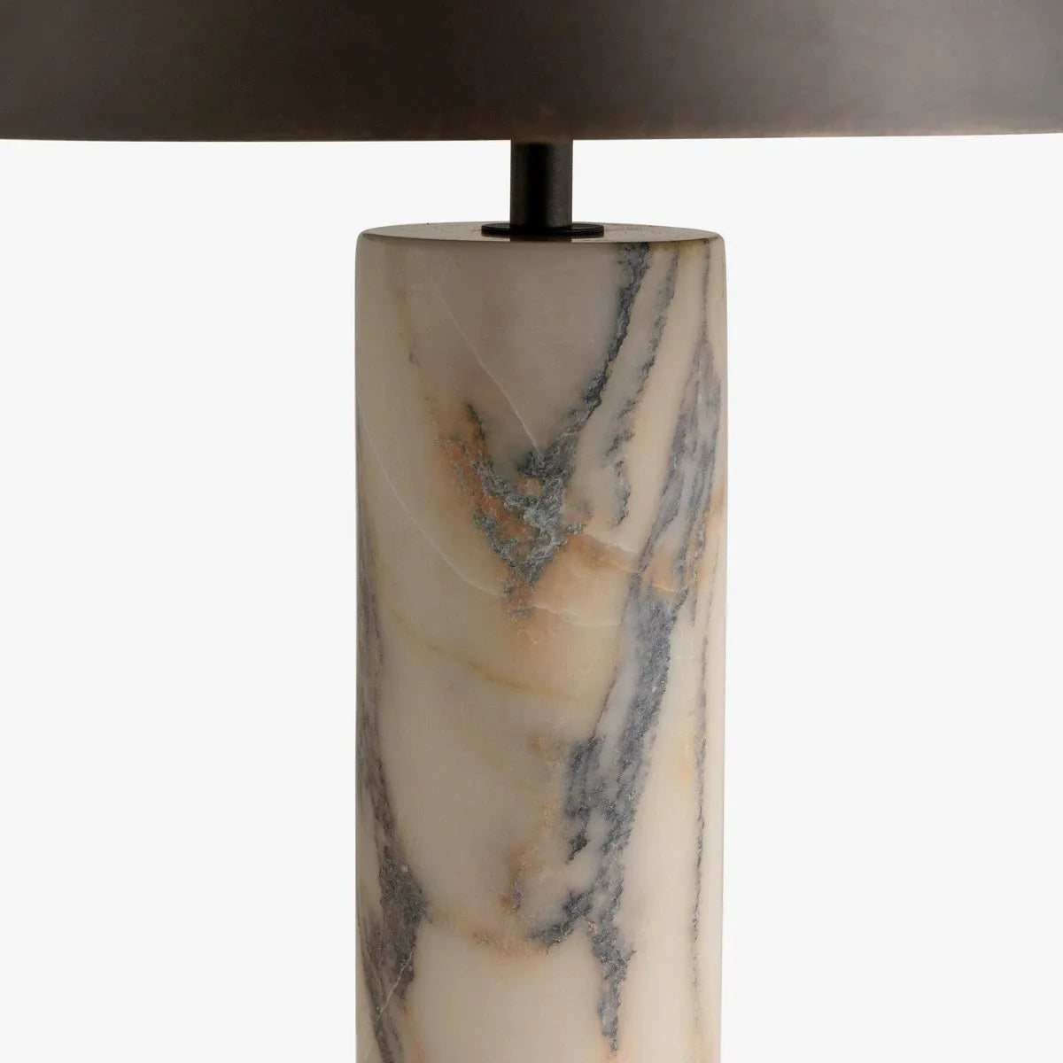 Black modern table lamp with a marble base on a wooden desk.