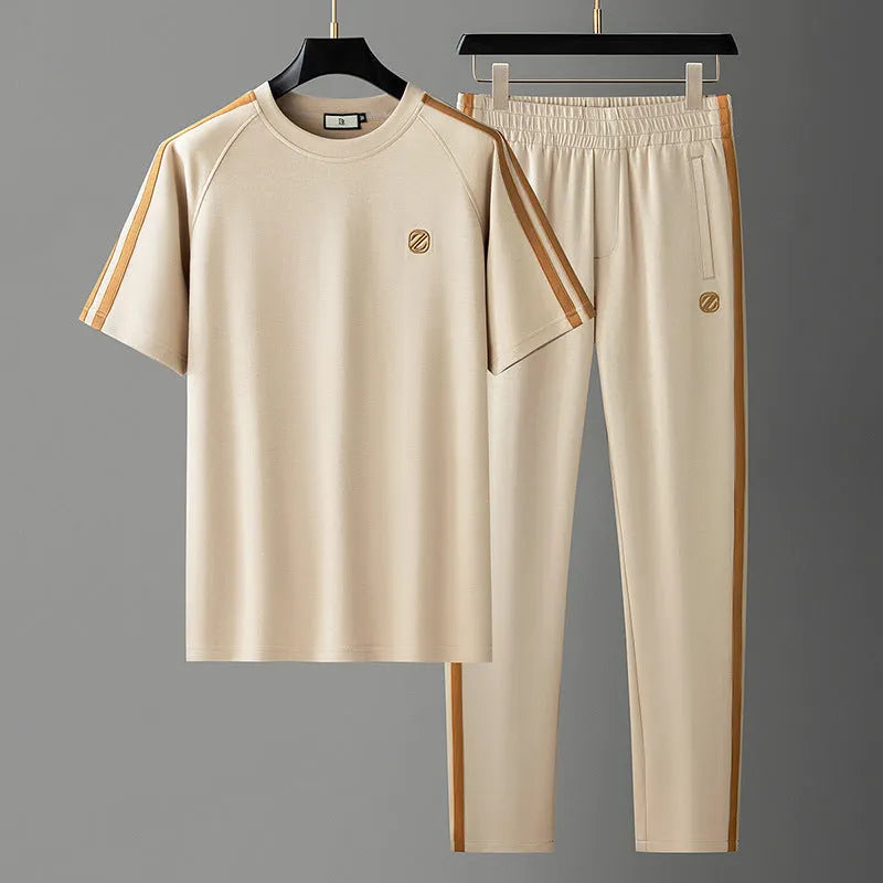 Men's blue ice silk style polyester sportswear set with short sleeve top and matching trousers